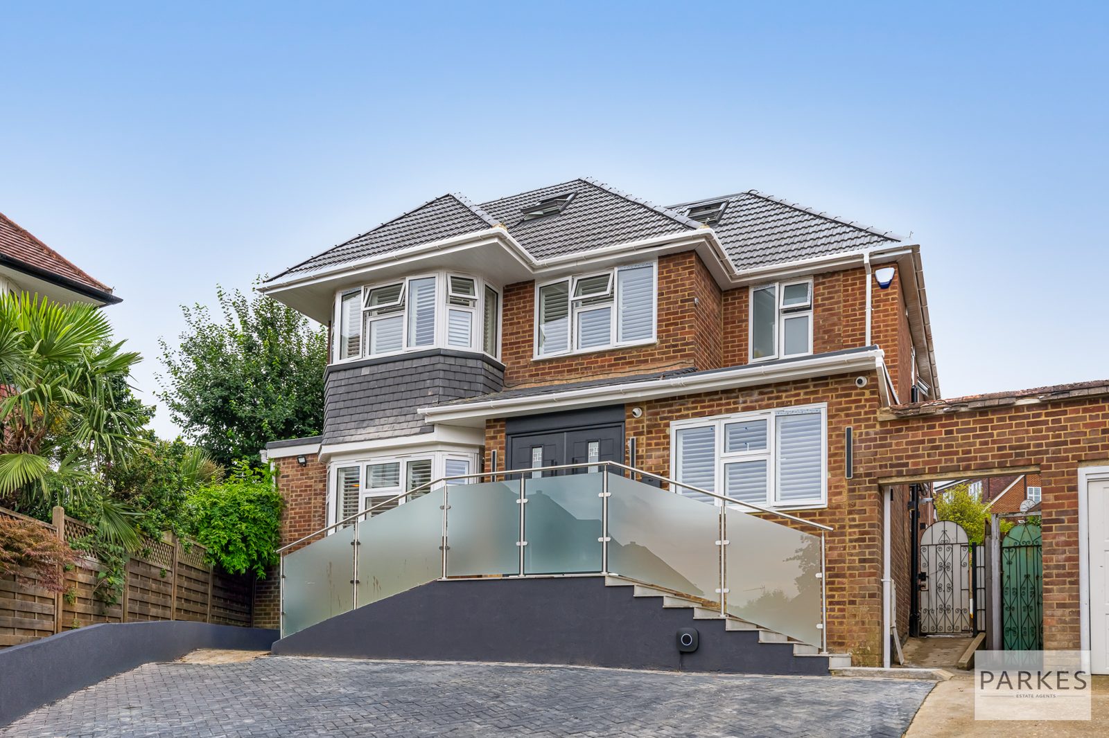 Refurbished front elevation with a new driveway