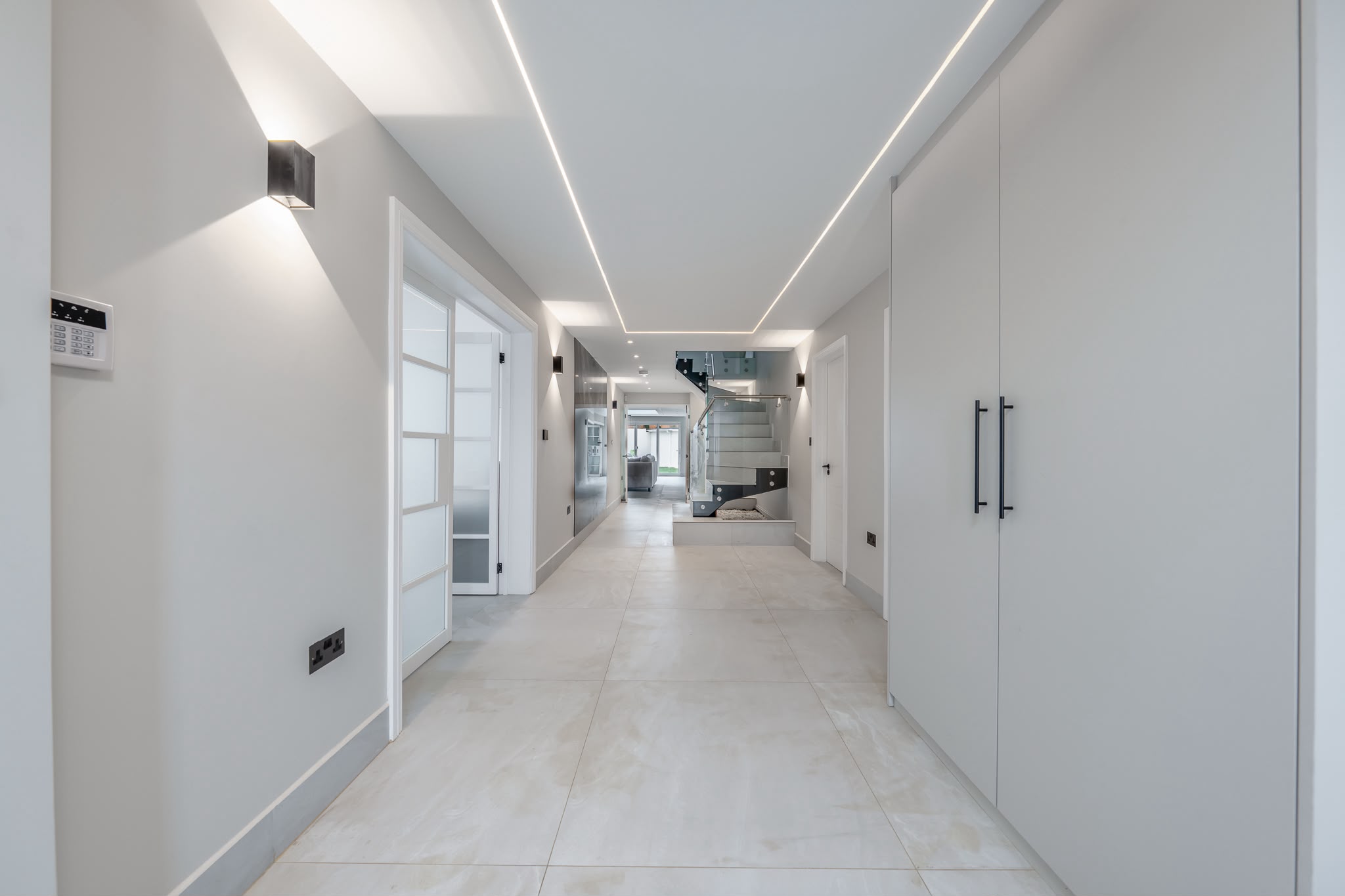 Kitchen and dining room with full-height glazing to a rear lightwell